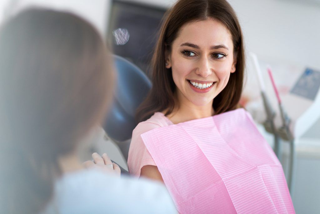 Dentist And Patient In Dentist Office